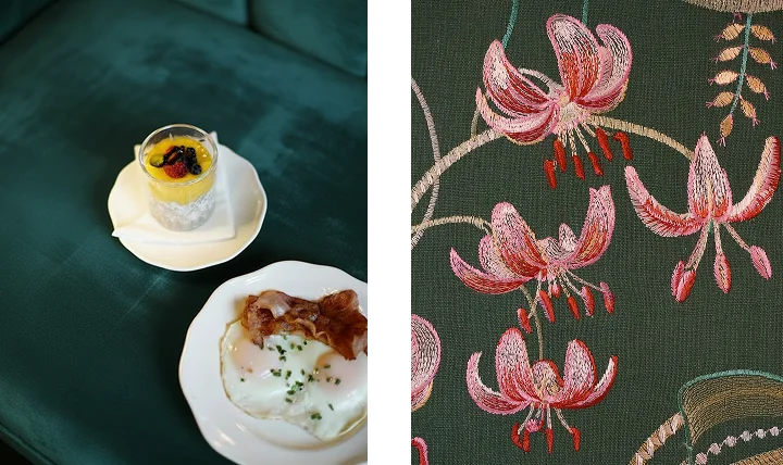 Lobby des Boutiquehotels Vier Jahreszeiten Salzburg mit elegantem Interieur, warmen Grüntönen und Kristall-Lüster