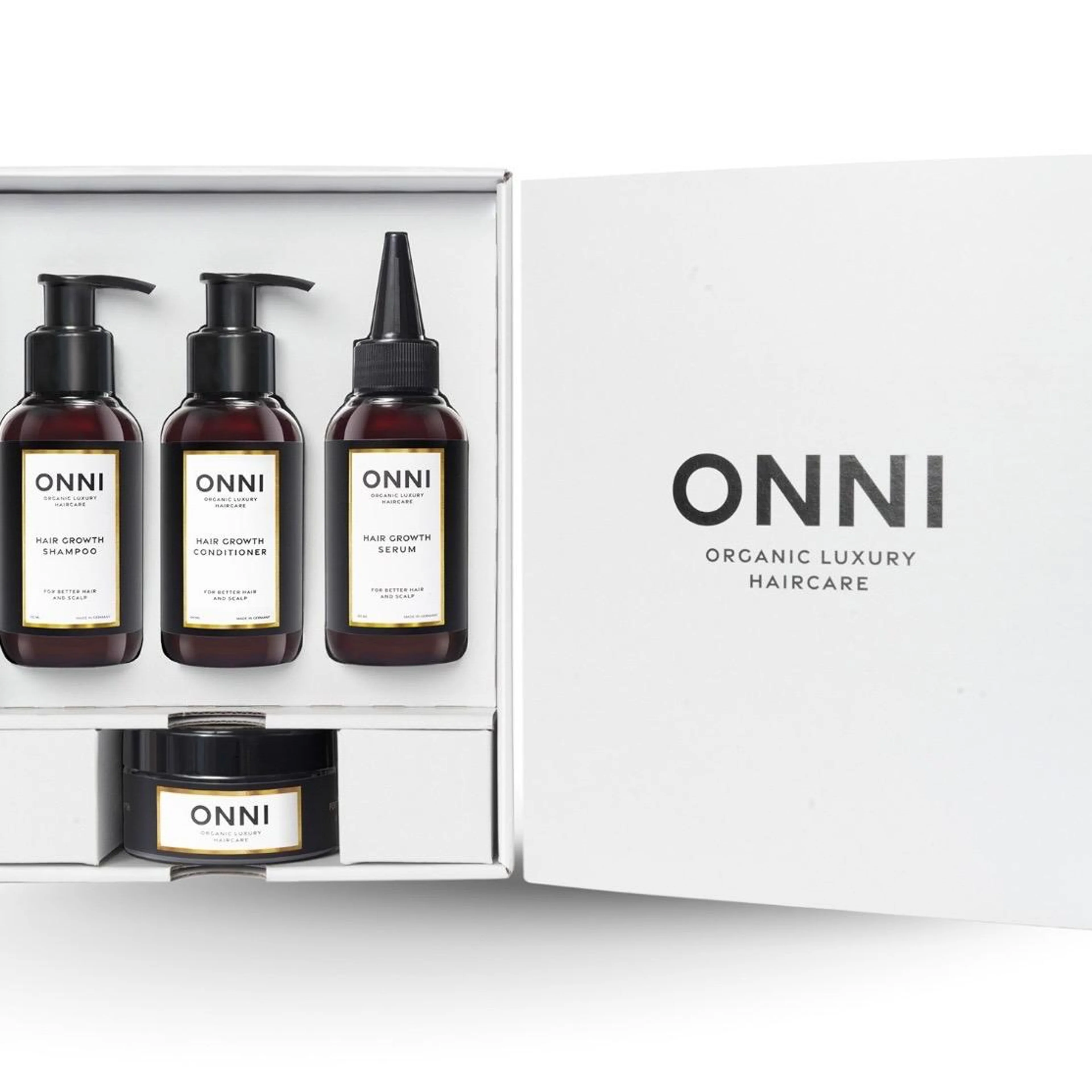 ONNI Organic Luxury Haircare Set bestehend aus Organic Hair Growth Shampoo, Conditioner, Serum und Kopfhautmaske in einer weißen Geschenkbox.