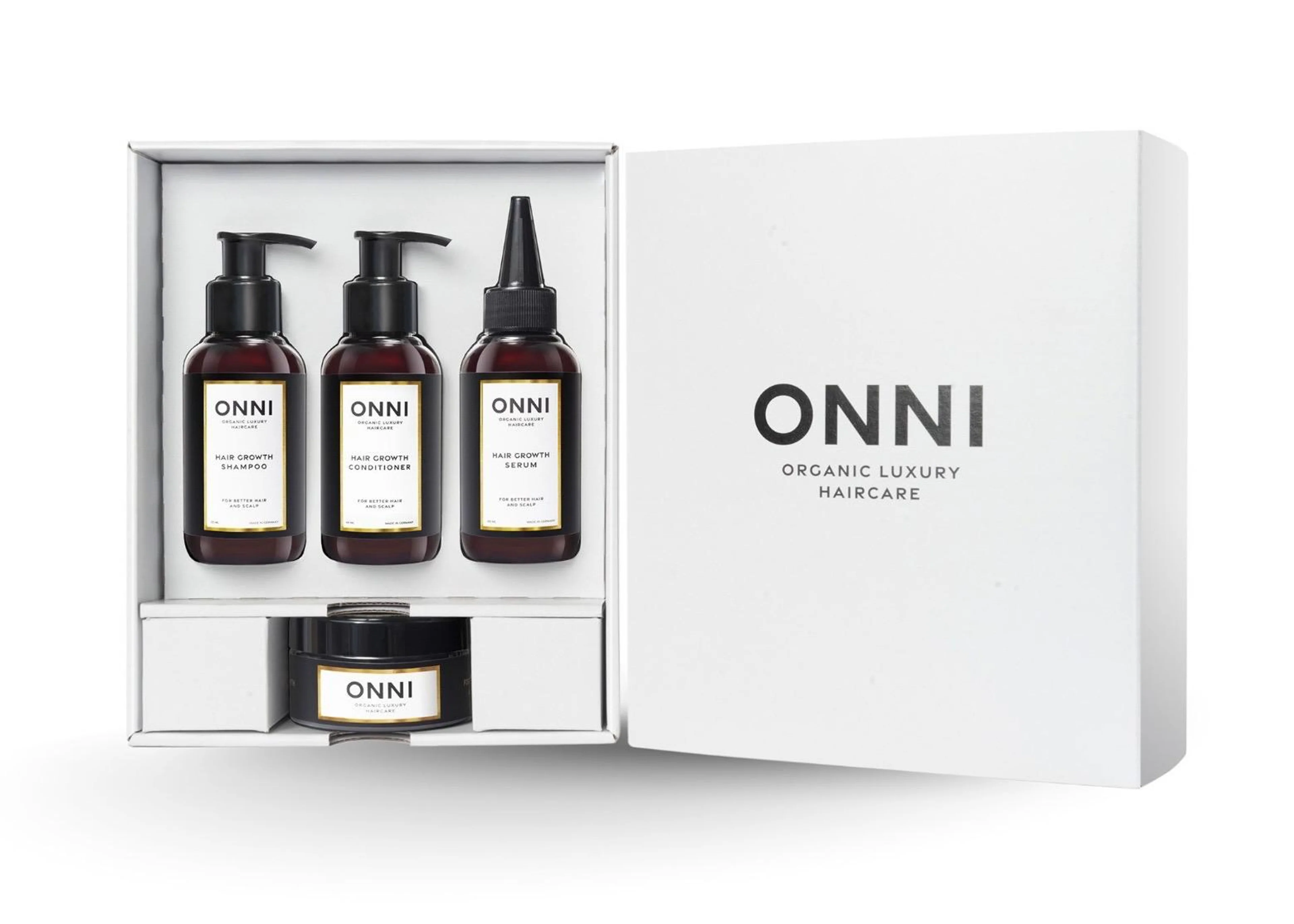 ONNI Organic Luxury Haircare Set bestehend aus Organic Hair Growth Shampoo, Conditioner, Serum und Kopfhautmaske in einer weißen Geschenkbox.